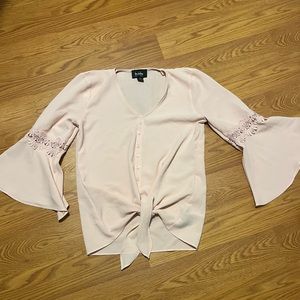 Light pink blouse with flare sleeves
